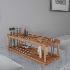 a bathroom with a sink, toilet and wooden tray on the counter in front of it