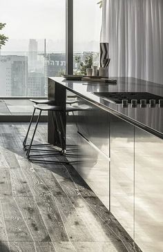 a modern kitchen with black and white decor