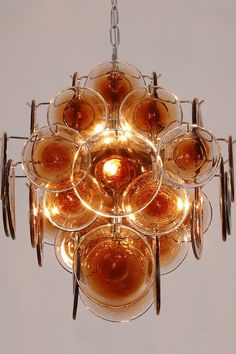 a chandelier with wine glasses hanging from it