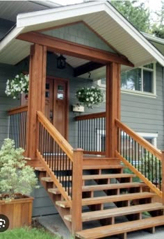 a house with stairs leading up to the front door