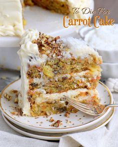 a piece of carrot cake on a plate with a fork in front of the cake