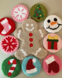 a group of knitted christmas ornaments sitting on top of a table