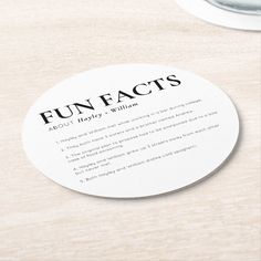 a white coaster that says fun fact on it