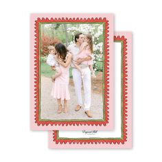 an image of two women and one child with their arms around each other in front of a pink background