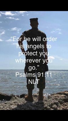 a soldier standing on top of a rock next to the ocean with a bible verse