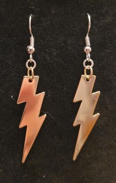 Large golden lightning bolt earrings. Lightning Themed Outfit, Lightning Jewelry, Birthday Plan Ideas, Mcqueen Costume, Lightning Mcqueen Costume, Golden Lightning, Lightning Earrings, Bolt Earrings, Denki Kaminari