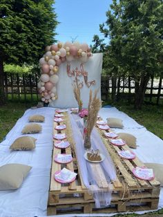 a table set up for a baby's first birthday