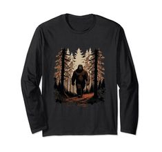 a bigfoot walking through the woods with trees on it's back t - shirt