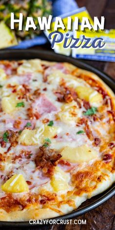 hawaiian pizza with pineapples and ham on the top is ready to be eaten