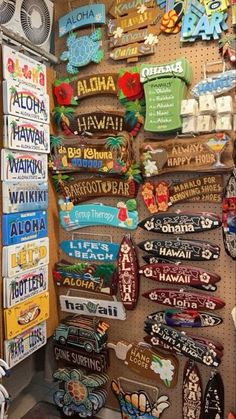 there are many different signs on the wall in this shop, and one is for sale