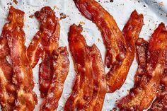 bacon strips sitting on top of a piece of paper