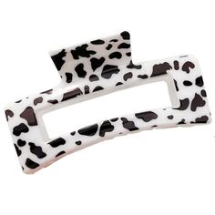 a white and black animal print buckle on a white background with the letter f in it