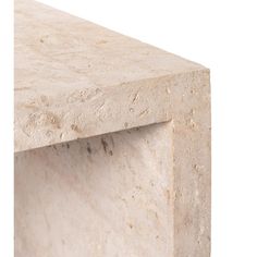 a close up view of a white marble table with the corner section missing from it