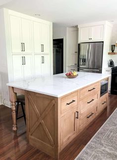 a large kitchen island with white counter tops