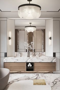 an elegant bathroom with marble counter tops and large mirrors on the wall, along with a chandelier