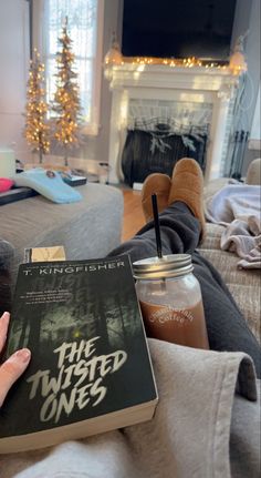 a person is reading a book in their living room