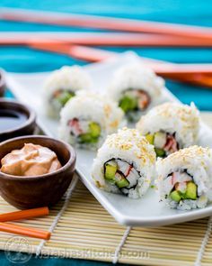 sushi rolls on a plate with dipping sauce