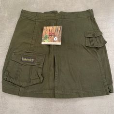 Embark on your next adventure in style with our Vintage Timberland Weathergea Cotton Cargo Skirt Shorts. Crafted for the intrepid traveler, these green cargo Skirt Shorts blend rugged utility with timeless safari-inspired design. Made from durable cotton, they're perfect for exploring the great outdoors or simply navigating the urban jungle with ease. With ample pockets for storing essentials and a comfortable fit for all-day wear, these vintage Skirt Shorts are both practical. Timberland Weathe Green Cargo Skirt, Vintage Safari, Skirt Shorts, Green Cargo, Vintage Rock, Cargo Skirt, Urban Jungle, The Urban, Vintage Skirt