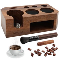 a cup of coffee next to a wooden holder