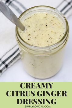 creamy citrus ginger dressing in a glass jar with a spoon on the side and text overlay reading creamy citrus ginger dressing