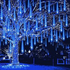 a tree that is lit up with blue lights