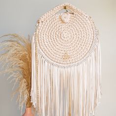 Need to wear something cool for a Saturday brunch party with the girls? ...or maybe you are finally taking a weekend vacation to that dreamy beach? The stylish shape, color, and fringes of Coquito Purse will make that special occasion memorable! You can use the gold chain to carry it in a crossbody style or hold the upper handle as a handbag! Details Includes a gold metallic chain for a crossbody style. Fabric cover for storage. Button closure. The metal accessory will not change color over time Bohemian Beaded Crossbody Bag, Luxury Beaded Fringe Bag, Crossbody Crochet Bag, Bohemian Natural Macrame Shoulder Bag, Luxury Fringe Crossbody Bag, Bohemian Beige Fringe Shoulder Bag, Saturday Brunch, Dreamy Beach, Brunch Party