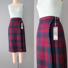 vintage nwt new old stock wrap front kilt skirt in burgundy red, navy and green tartan print. leather buckled straps on both sides. high banded waist, pleated back and fringed front side.  100% wool made in Great Britain for Ben Nevis circa 1980s fits like small: 28" waist 29" length Condition: excellent ☞ more vintage skirts here: https://etsy.me/3uXrIC0   ☞ The Veiled Ghost handmade jewelryhttps://etsy.me/32CDNCC  shop Adrian Company Vintagehttps://etsy.me/3u2Ewbi  follow on instagram: @adrian Kilt Fashion, Ben Nevis, Kilt Skirt, Green Tartan, Vintage Skirts, Wool Skirt, Leather Buckle, Kilt, Navy And Green