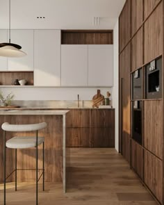 a modern kitchen with wooden cabinets and white counter tops, along with bar stools