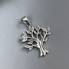 Sterling Silver Tree of Life Pendant with Oxidized Finish Pendant Height (including loop, excluding beil): Approx 28 mm (1.1 inch) Please  see other photos for size reference Sterling Silver Necklace Chains also available as add on.  Please see sizing chart and select length preference from Item Selection Options list MORE TREE OF LIFE PENDANTS IN THE STORE: https://www.etsy.com/shop/PendantsAndFinds?section_id=31921957 Shipping Policy:  Please see FAQs below Tiny Tree, Celtic Knot Pendant, Celtic Pendant, Sterling Silver Cross Pendant, Bee Pendant, Silver Cross Pendant, Silver Tree, Sterling Silver Chain Necklace, Tree Of Life Pendant