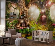 a baby's room with a tree mural on the wall and a crib next to it