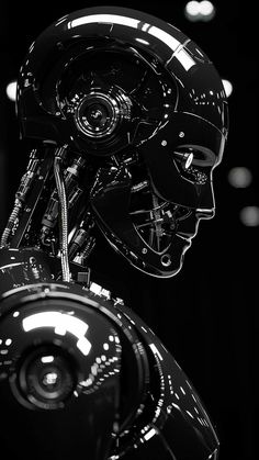 a black and white photo of a futuristic looking robot with its head turned to the side