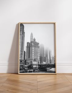 a black and white photo of a cityscape with skyscrapers in the background