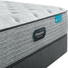 the beautyrest mattress is shown in front of a white background and blue label on it