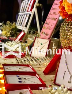 a table topped with lots of jewelry on display