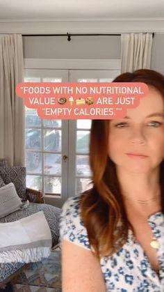 a woman standing in front of a window with a sign above her head that says foods with no nutritional value are just empty calories