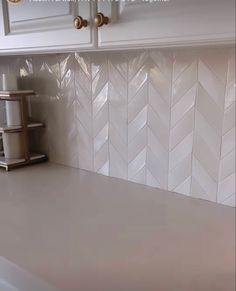 the kitchen counter is clean and ready to be used as a tile backsplash