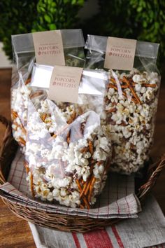 two bags of popcorn sitting on top of a table