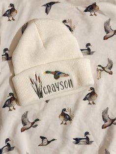 This is a toddler hat.  Personalized Embroidered Mallard beanie hat.  This can be personalized or left without a name- If you want a different thread color for the name please feel free to message me and I will send you options!  Free Shipping :) White Embroidered Flat Bill Hat, Custom Embroidered White Hat, White Snapback Trucker Hat For Winter, White Custom Embroidered Hat, White Flat Bill Hat For Winter, White Winter Flat Bill Hat, White Flat Bill Winter Hats, Adjustable Beanie With Embroidered Logo, Adjustable White Trucker Hat For Winter