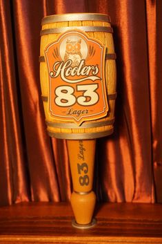 an old fashioned wooden beer keg with the number 85 on it's side