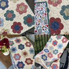 four quilts with flowers on them sitting next to each other