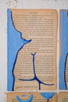 three pieces of art that are on top of an old book with blue writing and images of birds