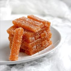 some sugary treats are on a white plate and ready to be eaten by someone