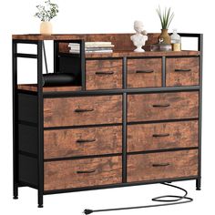 a wooden dresser with black metal handles and drawers