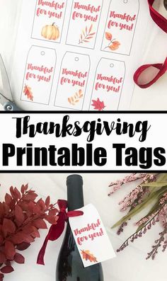 thanksgiving printable tags with fall leaves and red ribbon on them next to a bottle of wine