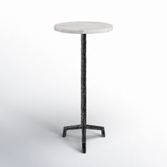 a white marble table with black metal legs and an iron base, on a white background