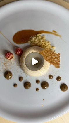 a white plate topped with food on top of a wooden table