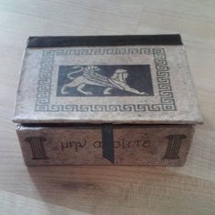 an old box sitting on top of a wooden table