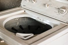 a white washer sitting inside of a kitchen next to a dryer