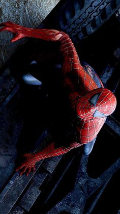 the amazing spider - man is standing on his knees