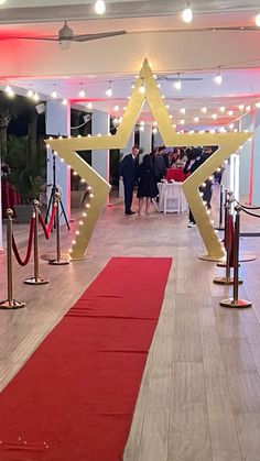 a red carpeted hallway with gold star decorations